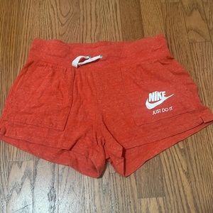 Red-Orange, Nike Shorts, Size Medium.